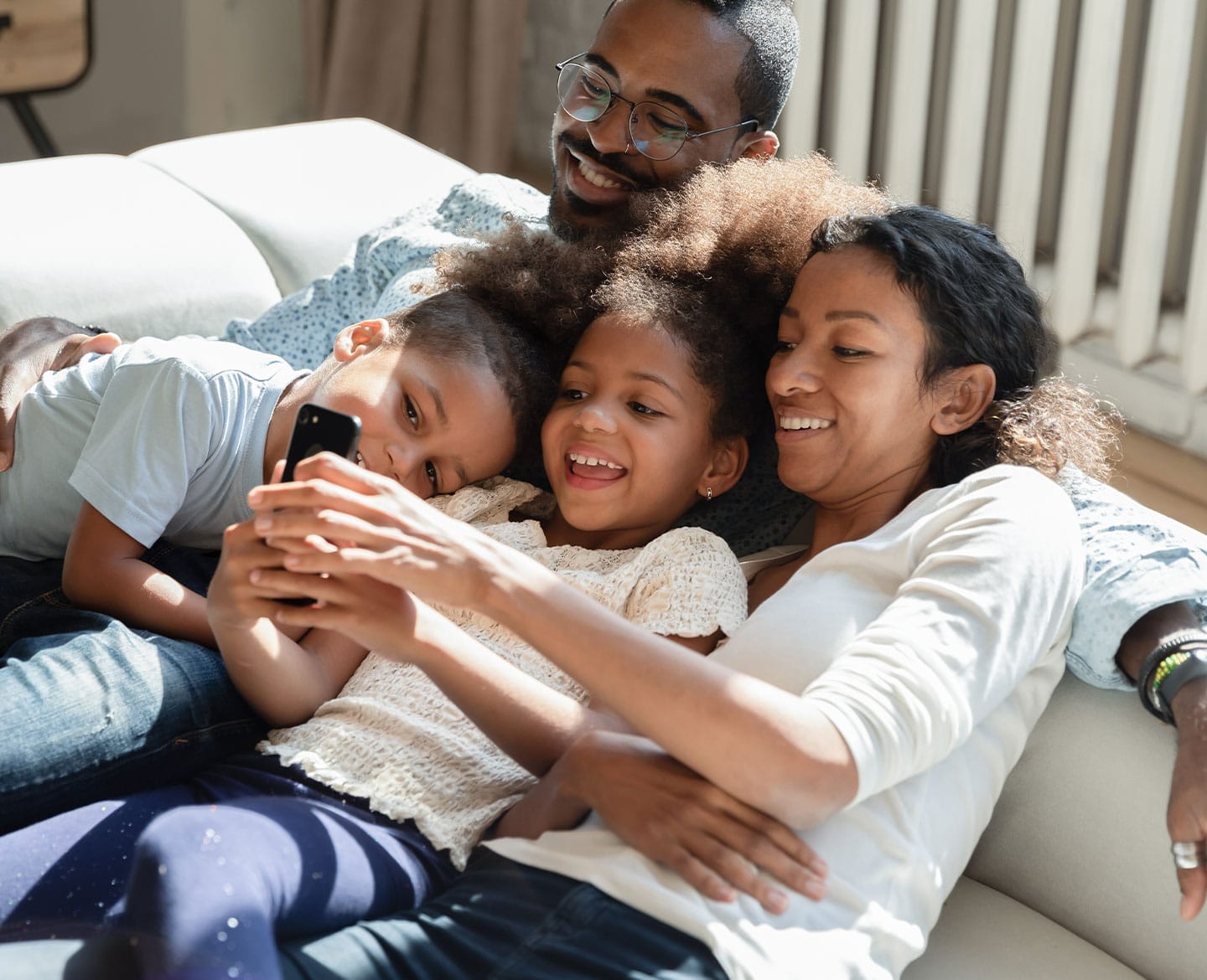 middle mom laughing with her family