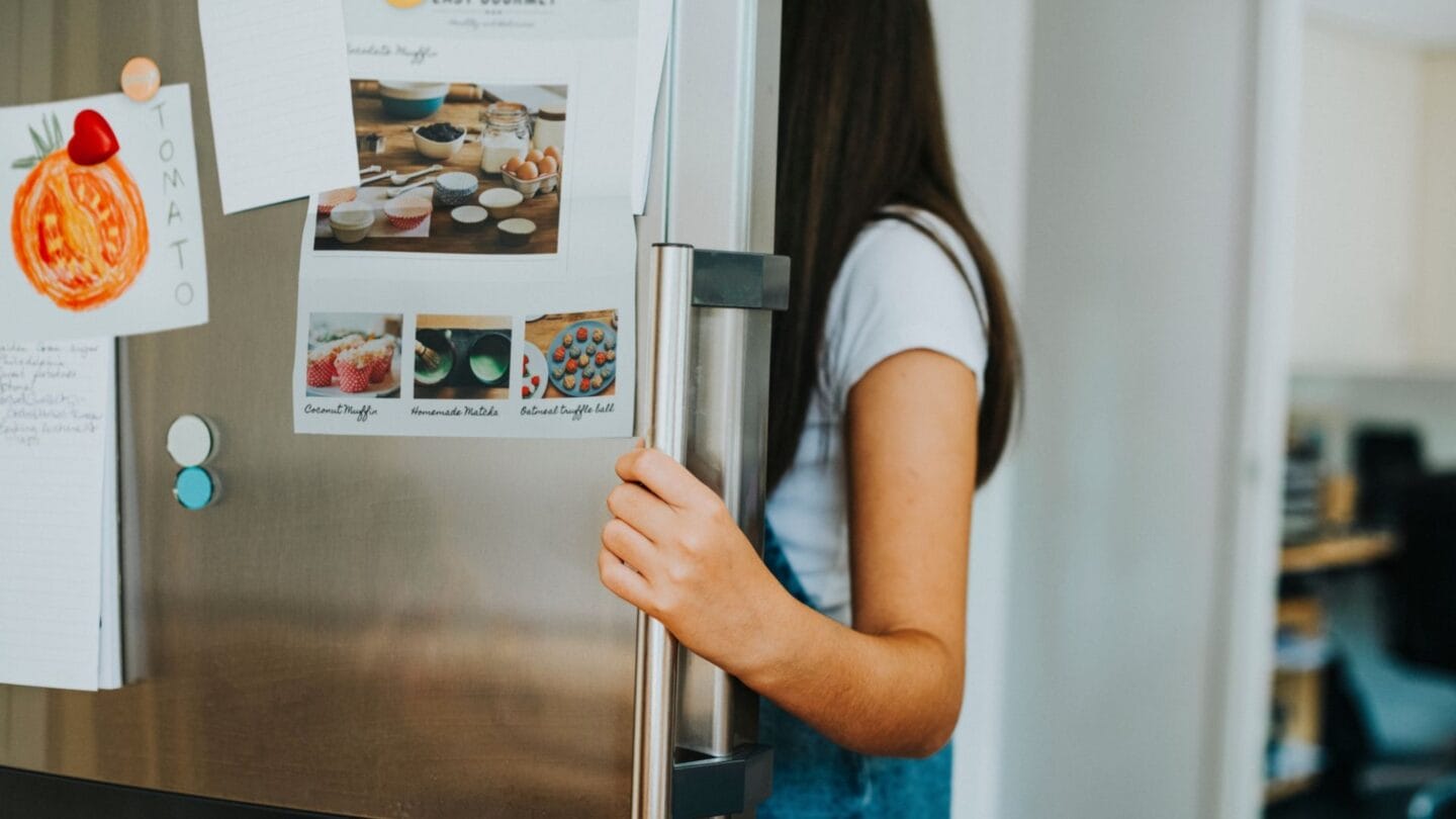 girl opening fridge - easy meals for kids