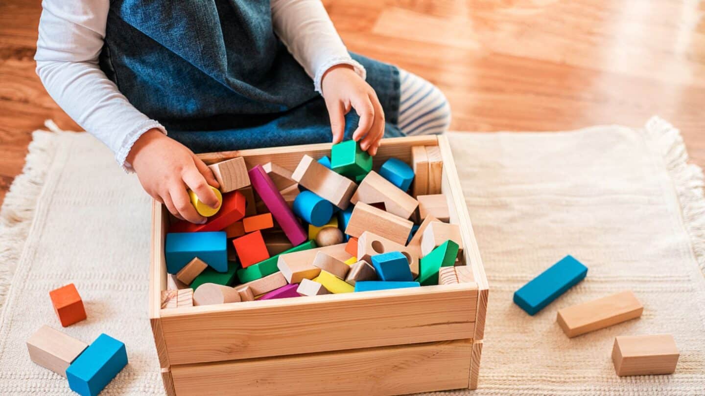 little girl cleaning up - how to teach kids to clean up