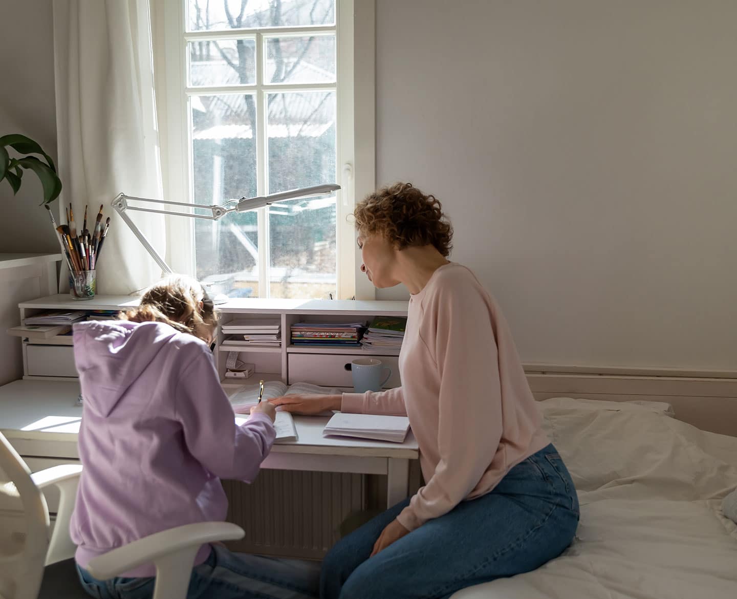 mom helping her kid do homework and deal with tough teacher