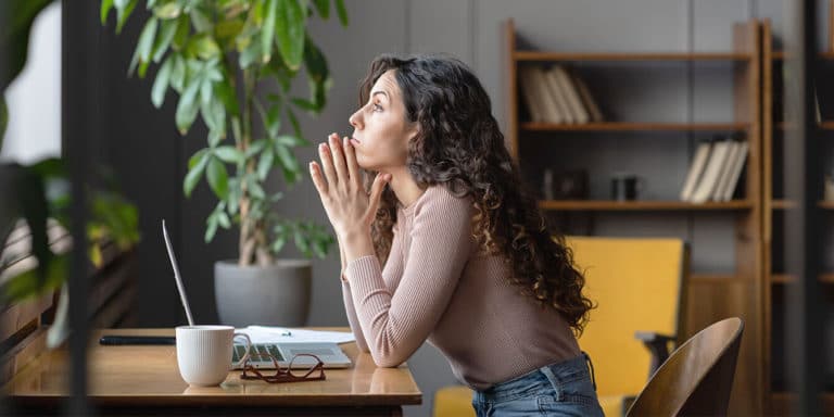 woman-at-work-looking-out-the-window