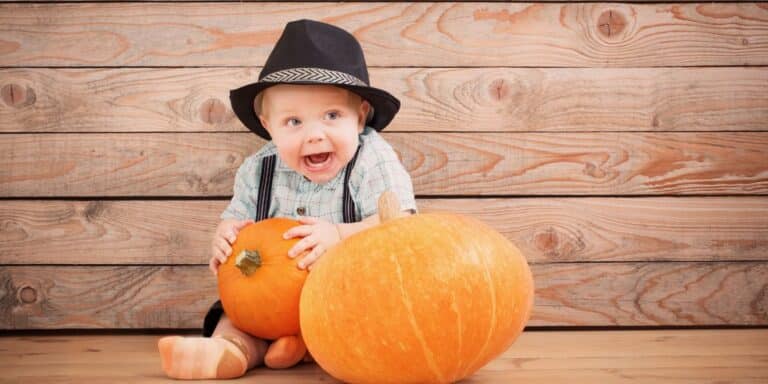 baby holding pumpkin- thanksgiving jokes