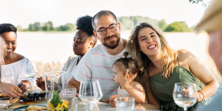 family eating together after cooking thanksgiving dinner