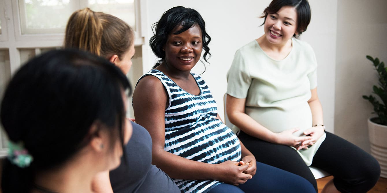 group-of-pregnant-women-talking - what to expect during labor for first-time moms