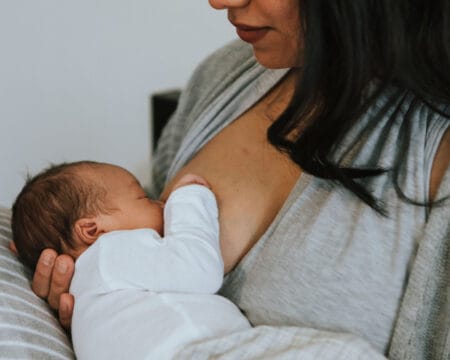 mom breastfeeding baby Motherly