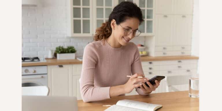 woman on phone - family calendars