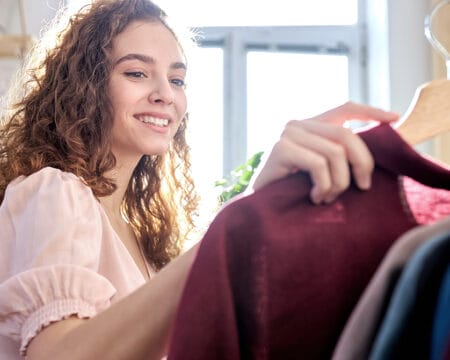 caucasian woman choosing cotton wear Motherly