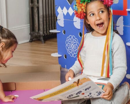 young girls playing board games Motherly