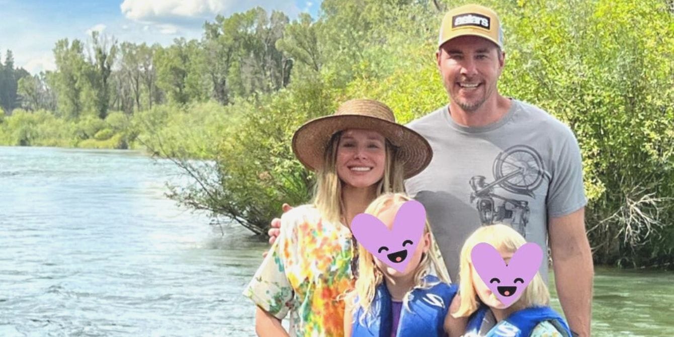 kristen bell and dax shepard with their two daughters by the lake- kristen bell on raising siblings