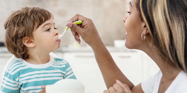 mom feeding toddler - how to make babyfood