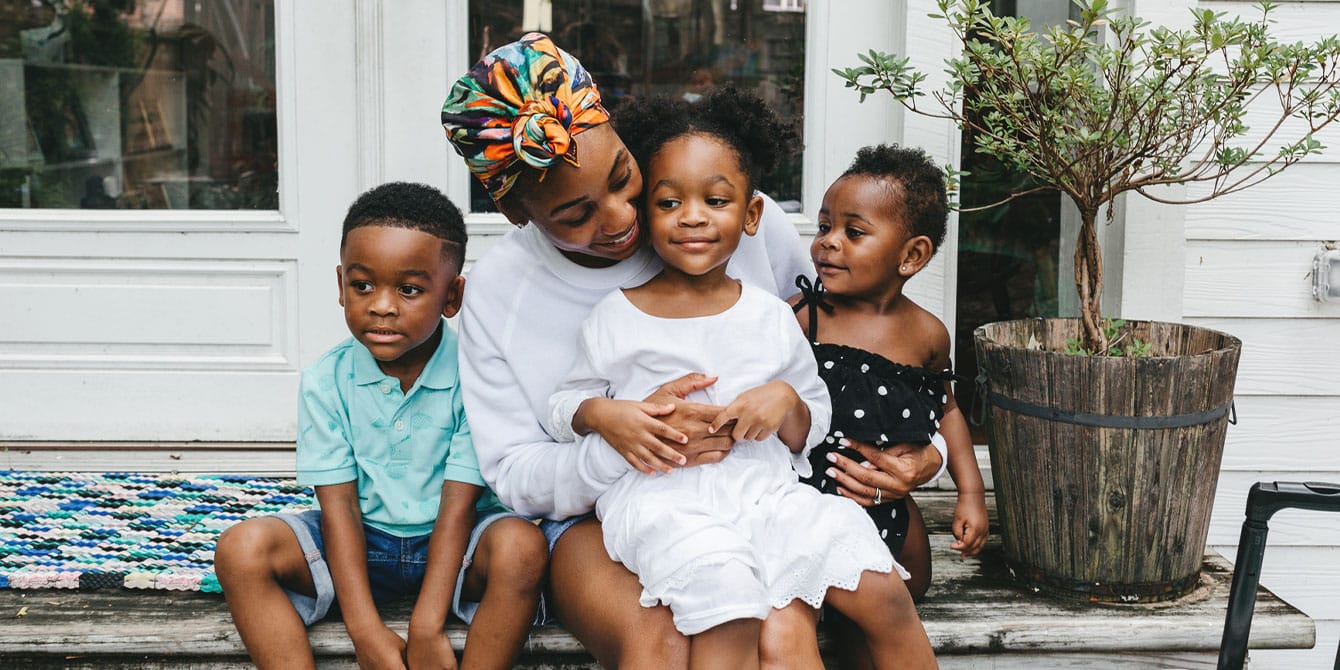 mom of three playing outside with her children