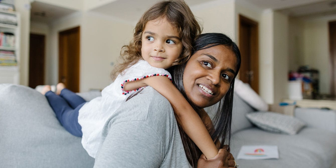 mother and daughter playing on the couch - highly sensitive parent