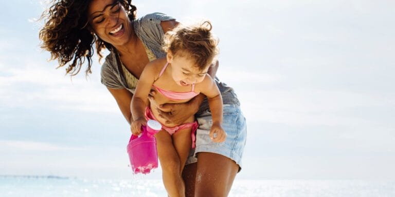 woman and small child having fun doing outdoor activities