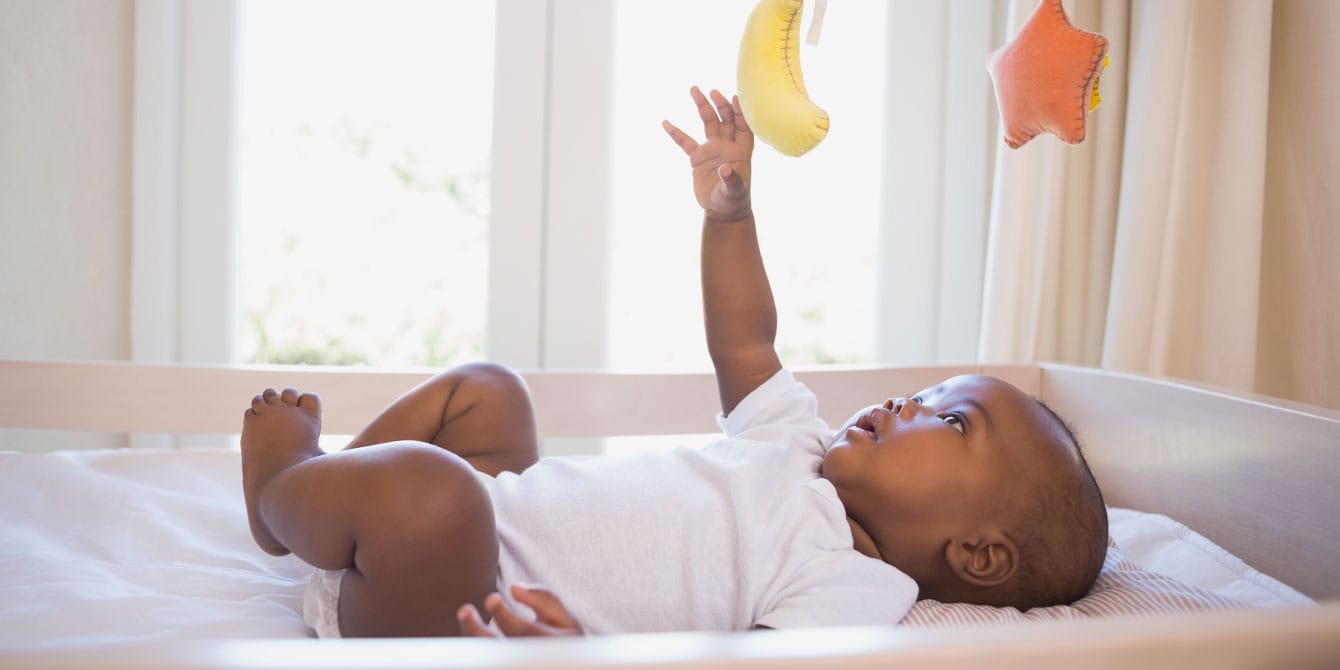 6-month-old baby playing with mobile - 6-month-old baby weight