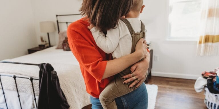 mom hugging child to honor grieving mothers who lost children to gun violence