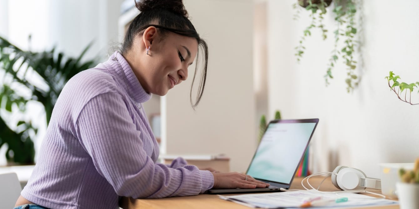 mom at computer thinking her career makes her a better mom