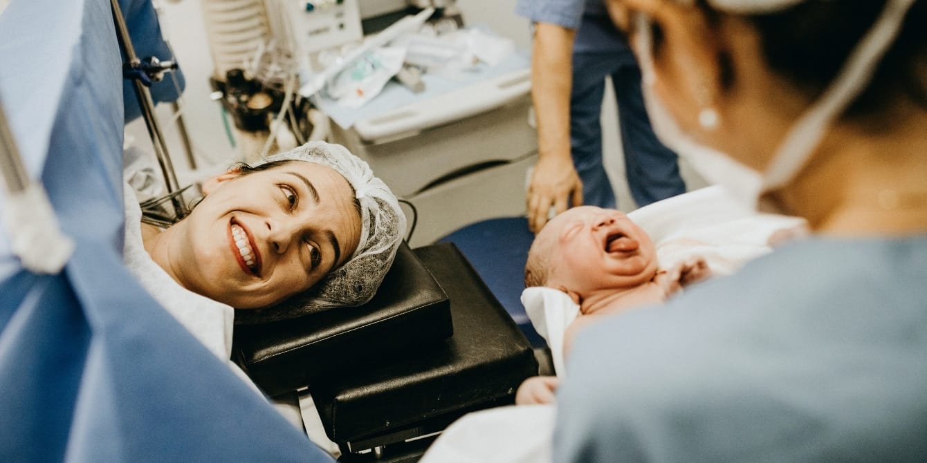 mother smiles after c-section - hypnobirthing for c-section