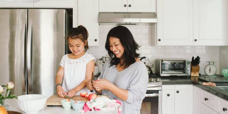 mom letting child help with chores at home