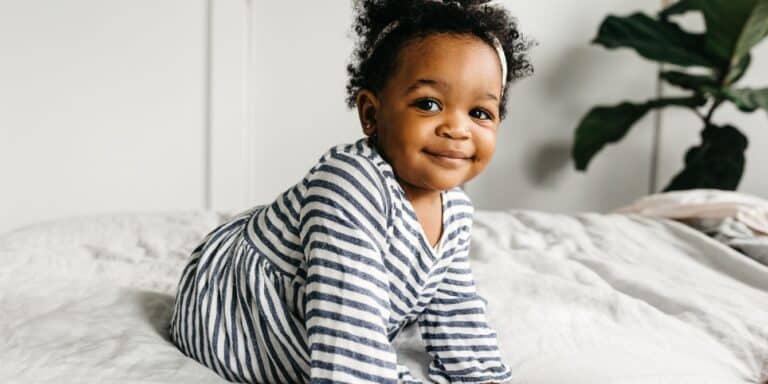 cute toddler crawling on bed - 2-year-old milestones