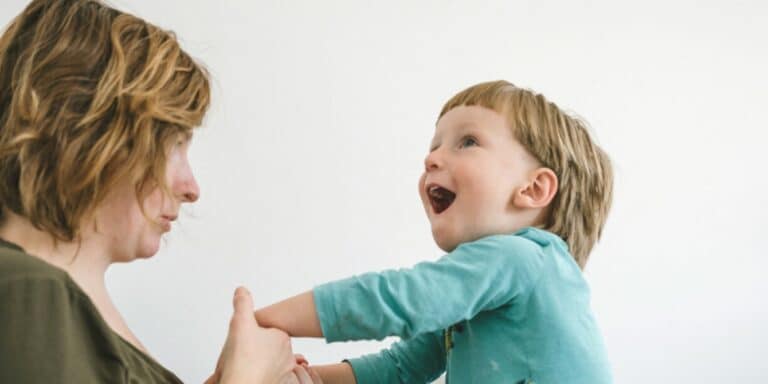 mom playing with her son - she's an overstimulated toddler mom