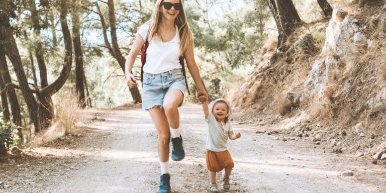 mom on nature walk with kid