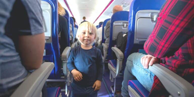 Toddler runs up and down aisles on airplane