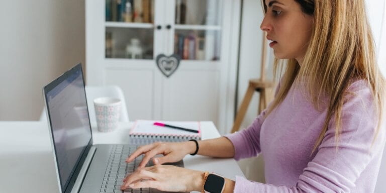 woman working on laptop from home - retirement planning for moms