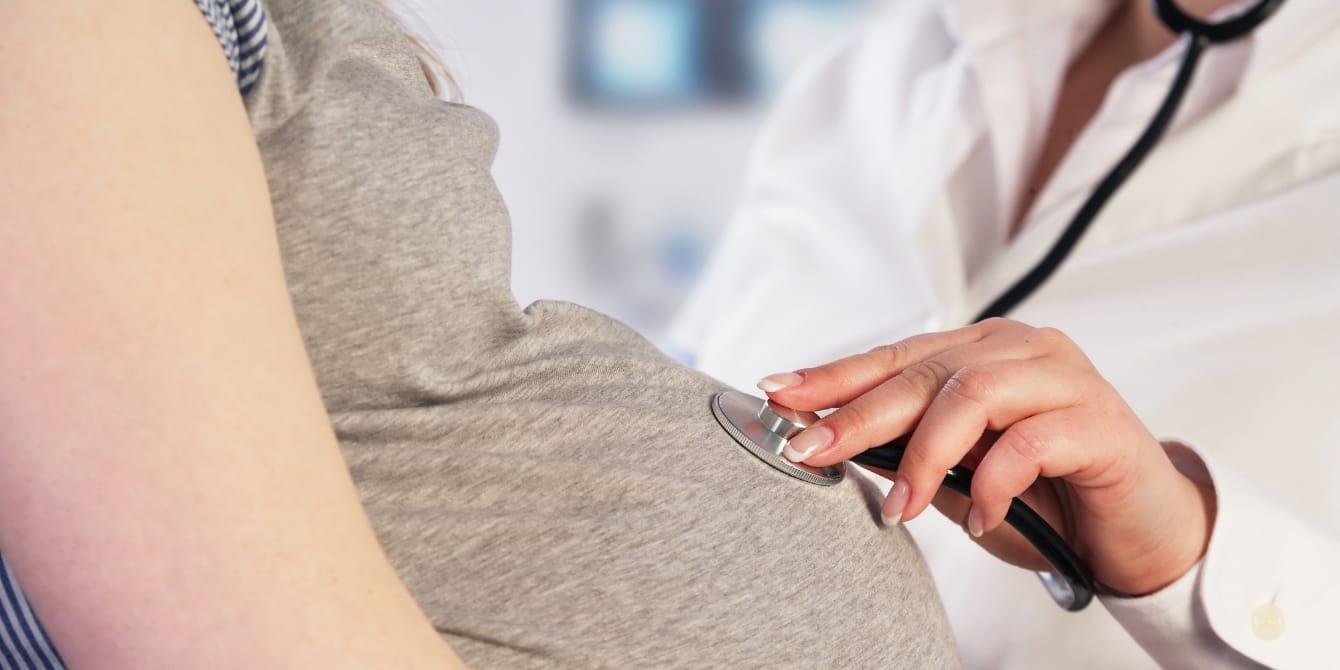 Doctor examining a pregnant woman - switching ob-gyns