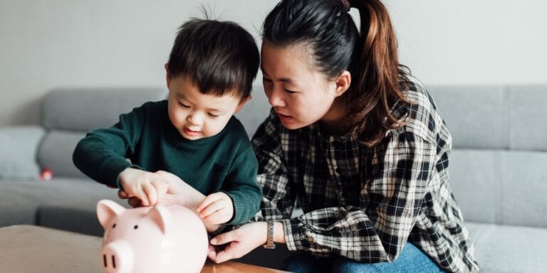 mom and son saving money- teaching kids money management