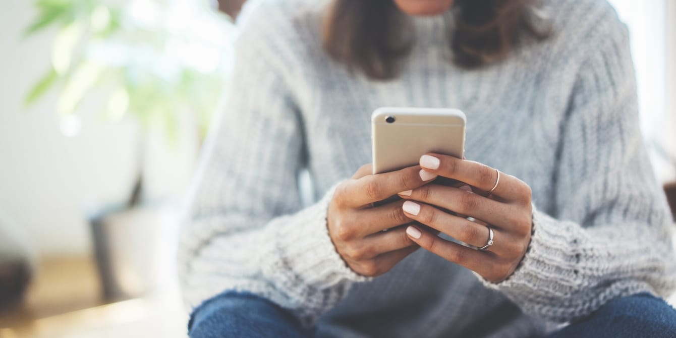 woman on the phone texting- how to connect with teens