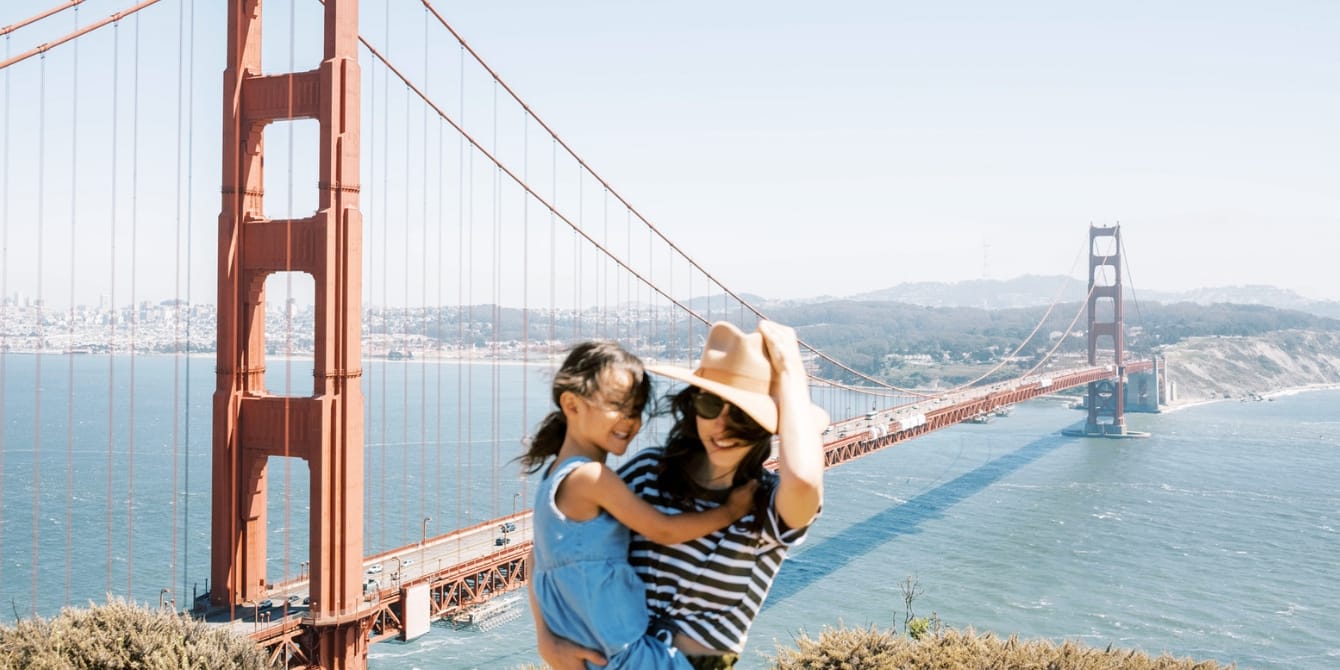 mom and daughter by golden gate bridge- staycation vs vacation