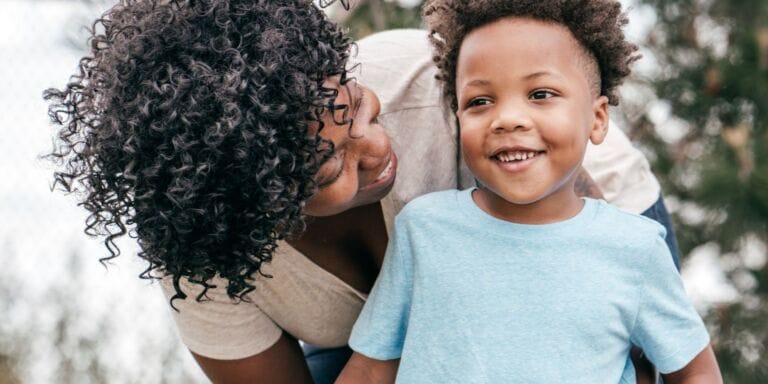 mom smiling at son - when to start potty training