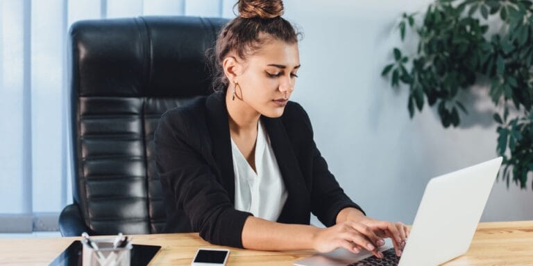 young business woman at work - hiding pregnancy at work