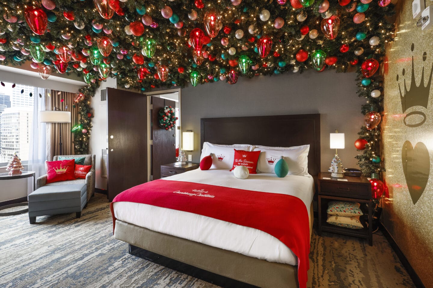 Hilton and Hallmark Channel Haul out the Holly Suite at Hilton Americas Houston Bed and Christmas Light Ceiling 2 Motherly