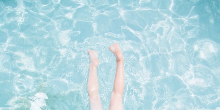 child's legs in a swimming pool - drowning is silent