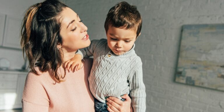 mom holding toddler son simple reframe talking to children