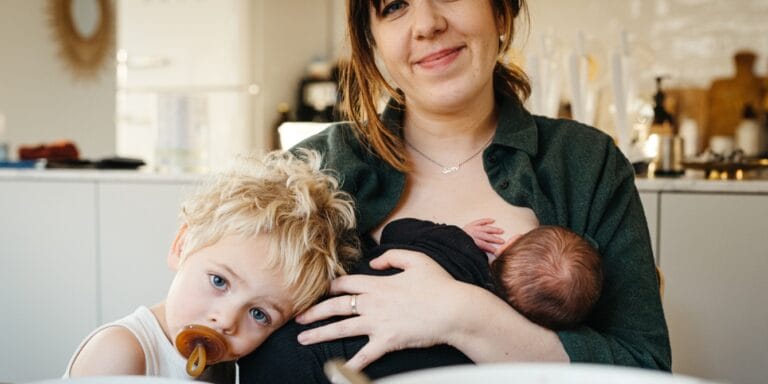 postpartum nutrition mom at breakfast holding baby