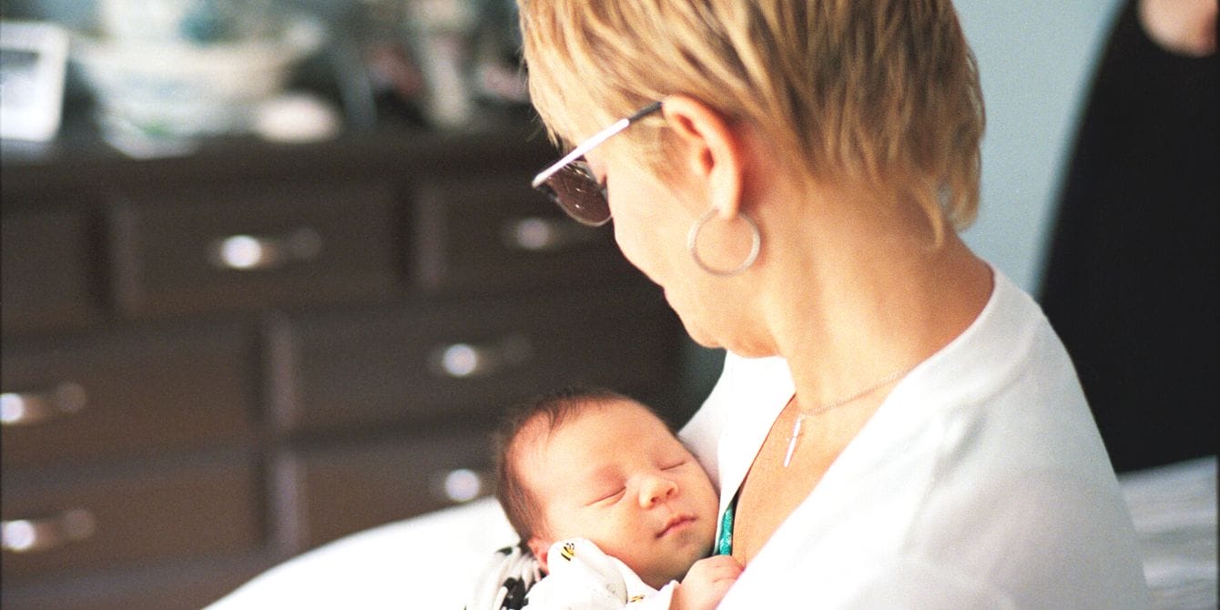 Grandma holding newborn