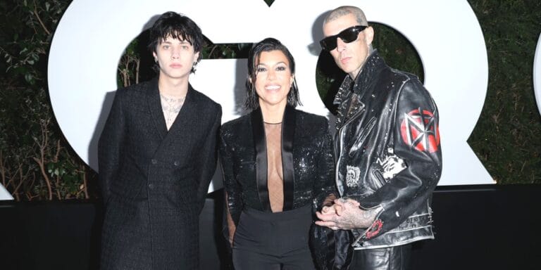 Landon Barker poses with Kourtney Kardashian Barker and Travis Barker