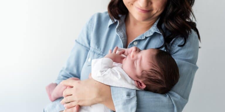 a mother looking down at her baby - independent motherhood