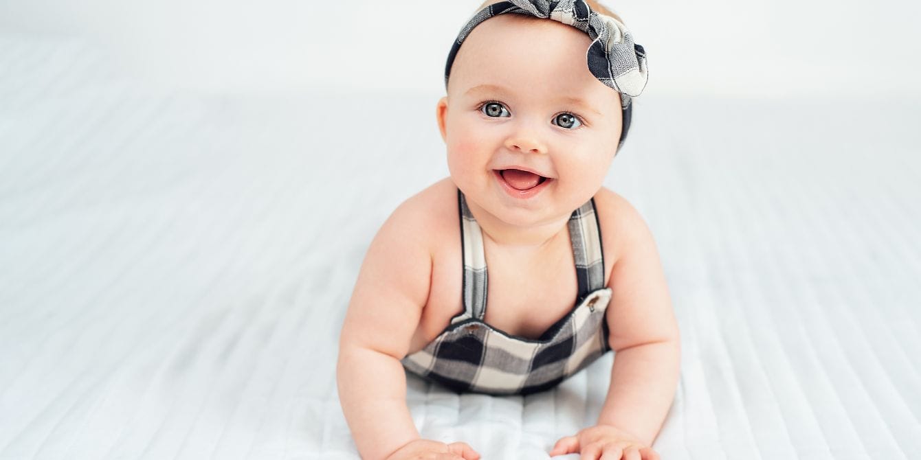 baby girl wearing bow- baby girl names