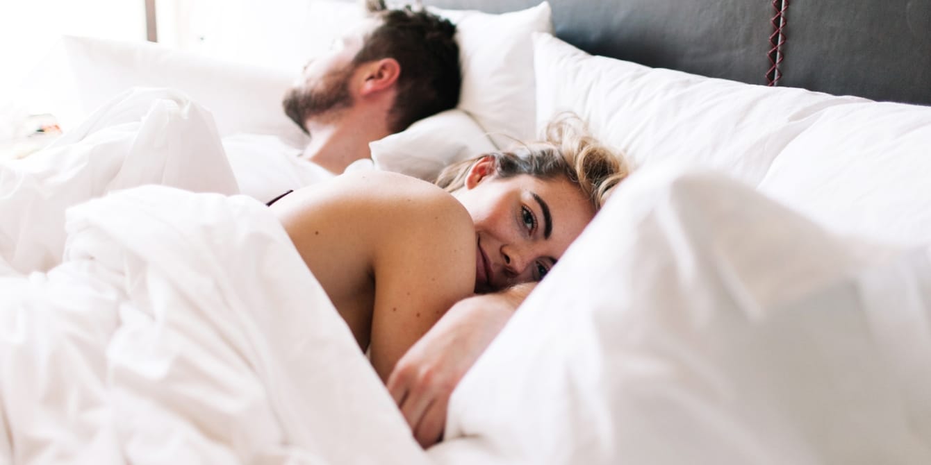 couple in bed together - reproductive seasonality