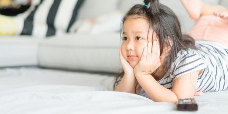 cute little girl watching tv - benefits of watching slow tv for kids