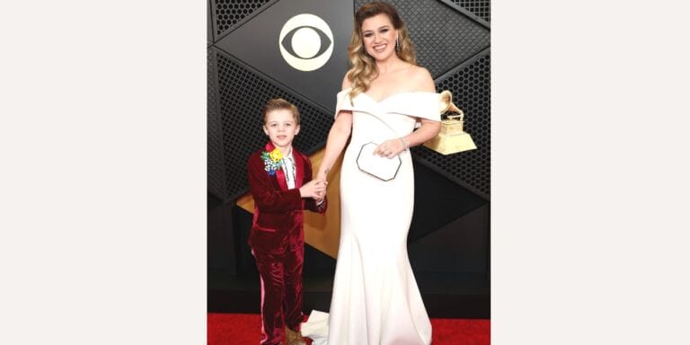 Kelly Clarkson poses on the Grammys red carpet with her son, Remi