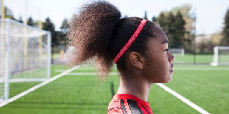 portrait of girl at soccer practice when to quit youth sports