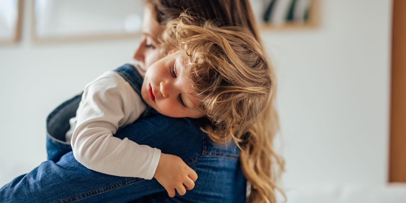 toddler boy hugging his mom airplane mode tantrums