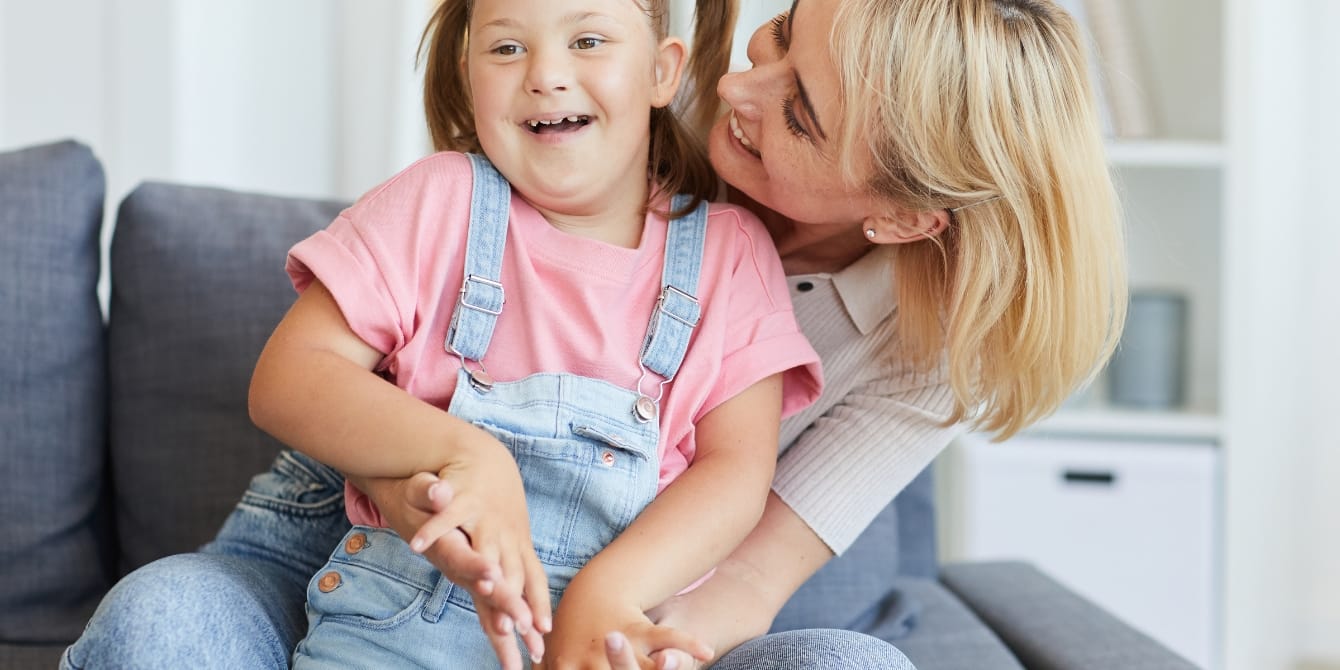 mom hugging disabled child- mothering a child with disabilities