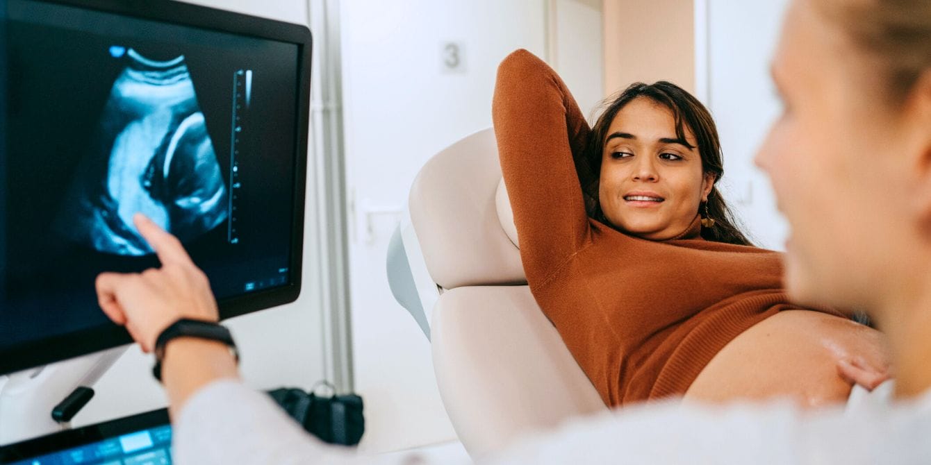 Pregnant woman getting ultrasound