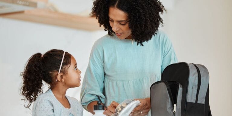 mom packing kid's lunch - packed lunches