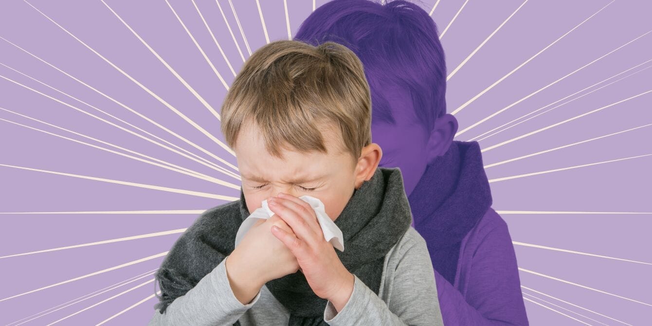 A young boy blowing her nose because he has walking pneumonia